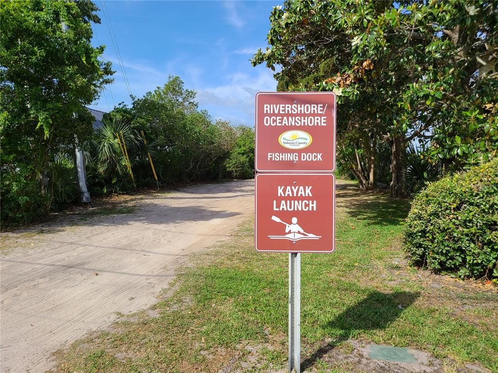 54 Rivershore Drive Ormond Beach, FL 32176 - Photo 32 of 38 a sign that is sitting on a brick wall