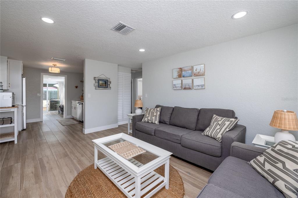 54 Rivershore Drive Ormond Beach, FL 32176 - Photo 5 of 38 a living room with furniture and wooden floor