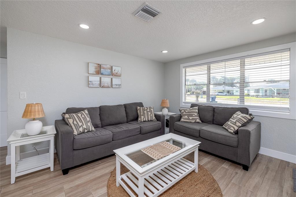 54 Rivershore Drive Ormond Beach, FL 32176 - Photo 6 of 38 a living room with furniture and a large window