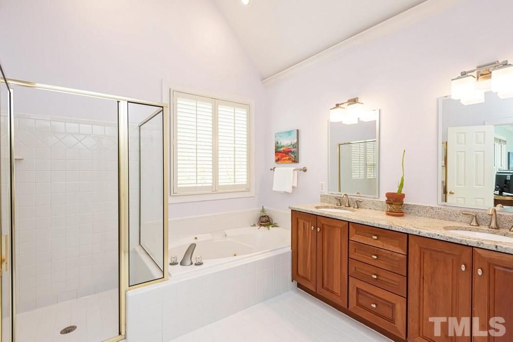204 Reedham Way Raleigh, NC 27615 - Photo 14 of 30 Master Bathroom has dual vanity sink with extra storage below and separate toilet room.