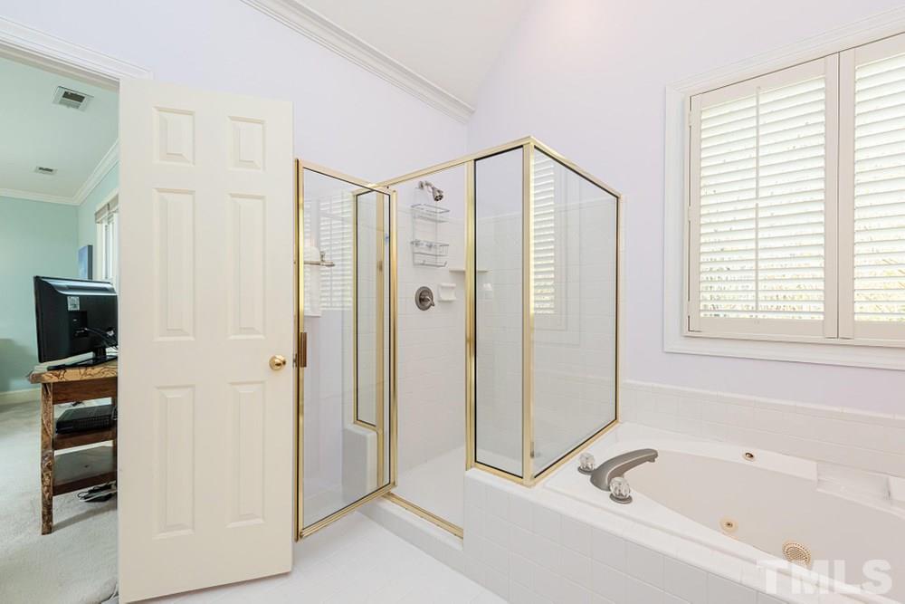 204 Reedham Way Raleigh, NC 27615 - Photo 15 of 30 Walk in shower and garden tub.