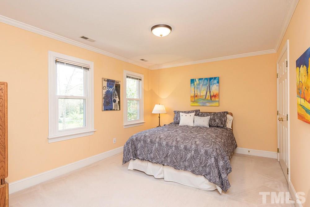 204 Reedham Way Raleigh, NC 27615 - Photo 16 of 30 Bedroom 2 with double windows and crown molding.