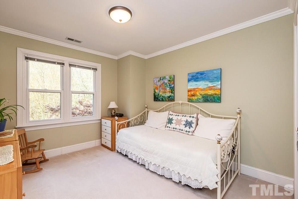 204 Reedham Way Raleigh, NC 27615 - Photo 17 of 30 Bedroom 3 with double windows and crown molding.