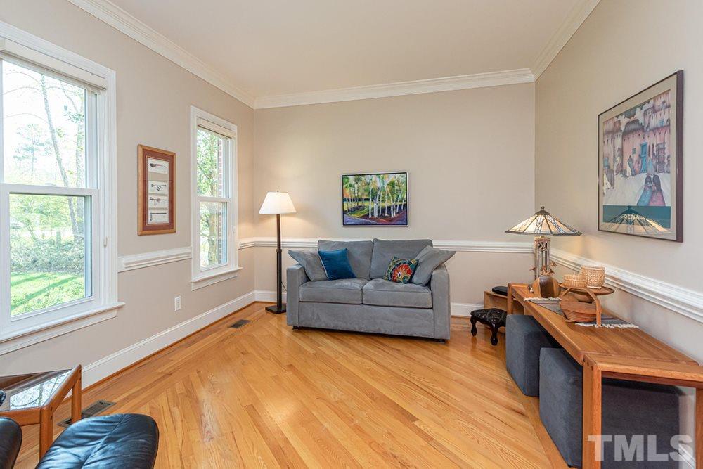 204 Reedham Way Raleigh, NC 27615 - Photo 3 of 30 Office/Living Room with gorgeous hardwood floors, crown moldig, and double front windows.