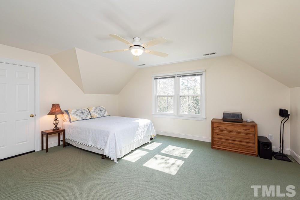 204 Reedham Way Raleigh, NC 27615 - Photo 22 of 30 Bedroom 5 located on the third floor with ceiling fan and double windows.