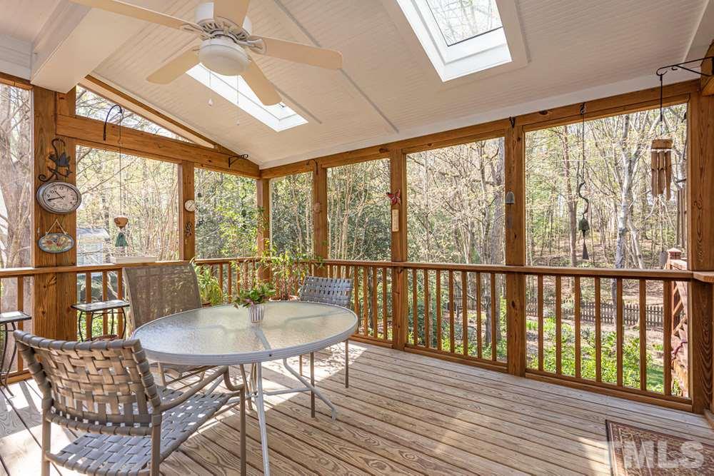 204 Reedham Way Raleigh, NC 27615 - Photo 24 of 30 Screen Porch with ceiling fan and skylights.