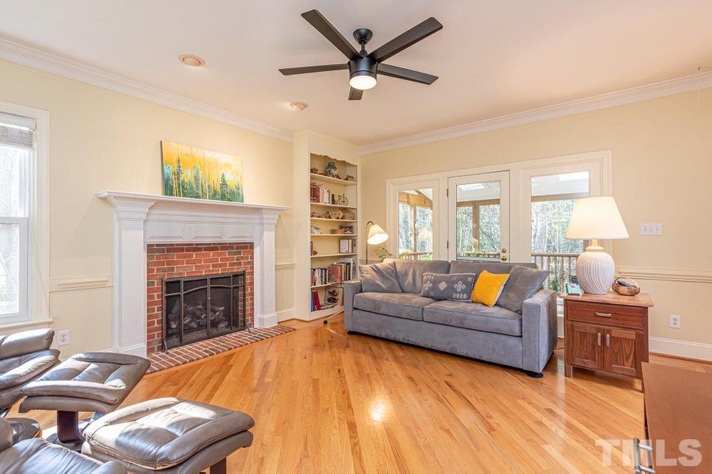 204 Reedham Way Raleigh, NC 27615 - Photo 4 of 30 Family Room features gas log fireplace and built ins.