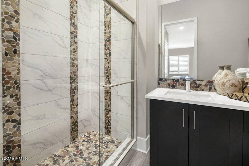 6516 Canyon Oaks Drive Simi Valley, CA 93063 - Photo 11 of 27 a bathroom with a sink and a mirror