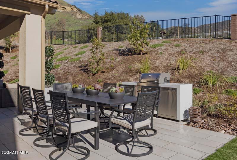 6516 Canyon Oaks Drive Simi Valley, CA 93063 - Photo 21 of 27 a view of a chairs and table on the terrace