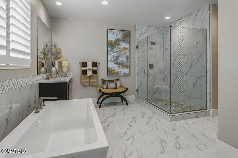 6516 Canyon Oaks Drive Simi Valley, CA 93063 - Photo 23 of 27 a bathroom with a bathtub and a shower