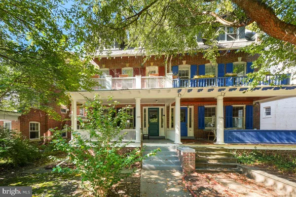 front view of a house with a garden
