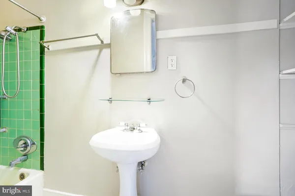 a bathroom with a sink and mirror