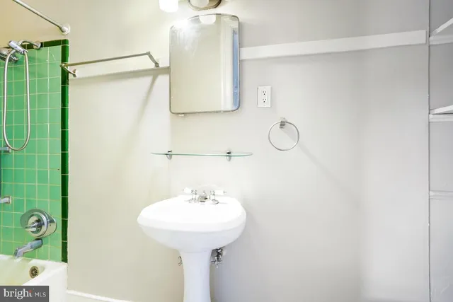 a bathroom with a sink and mirror