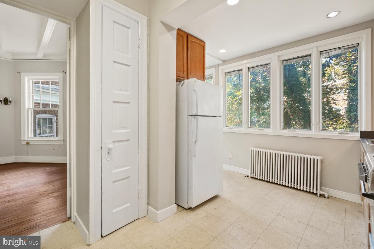 2256 Cathedral Avenue Northwest Washington, DC 20008 - Photo 18 of 23 a view of kitchen with furniture and refrigerator