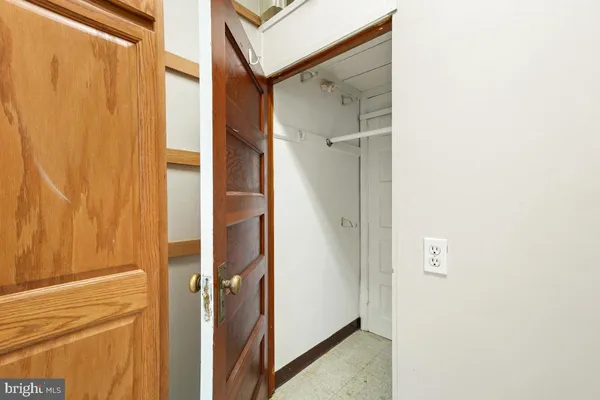 a bathroom with a glass shower door and a sink