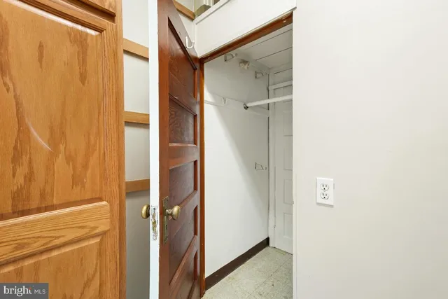 a bathroom with a glass shower door and a sink