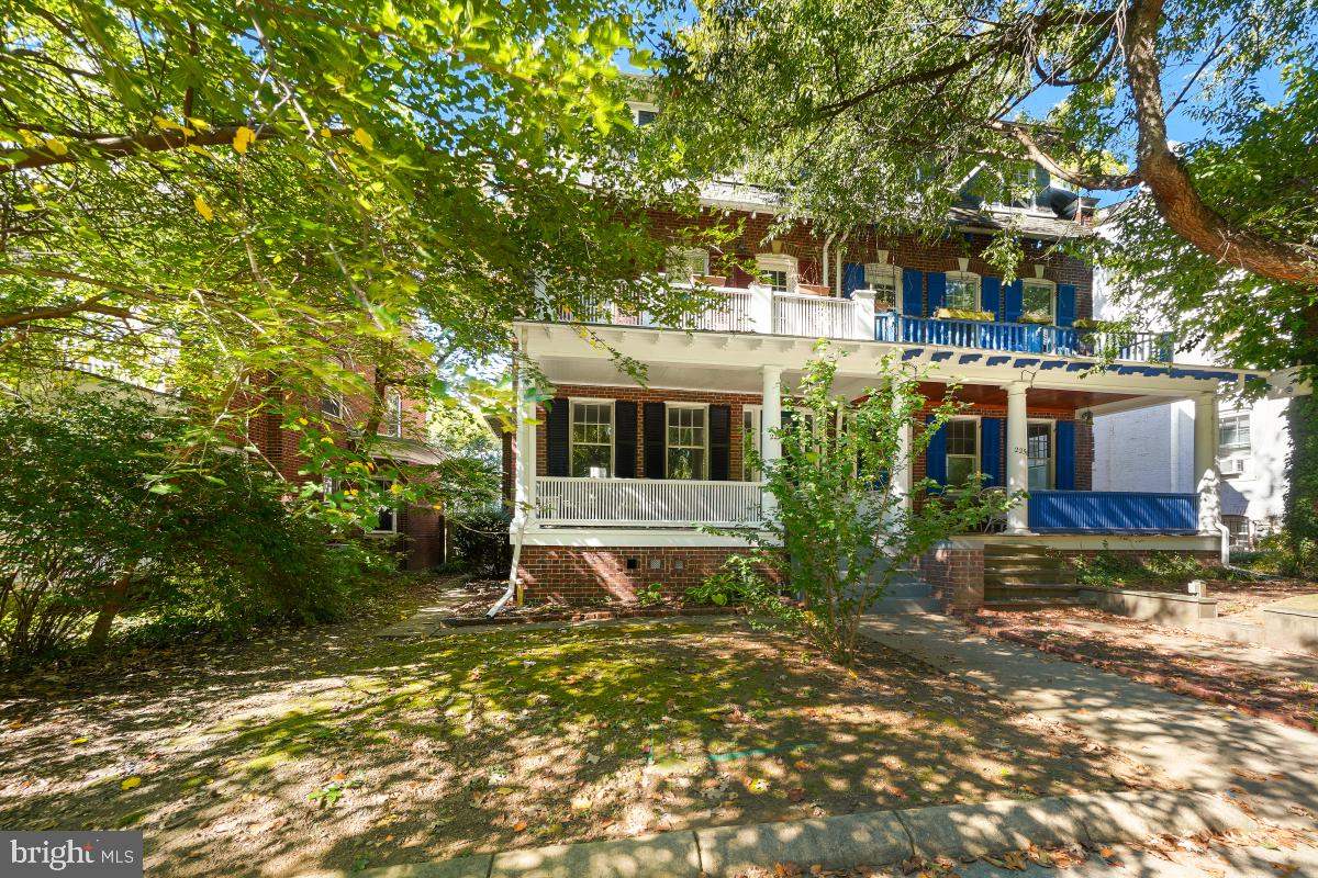 2256 Cathedral Avenue Northwest Washington, DC 20008 - Photo 2 of 23 a front view of a house with a garden