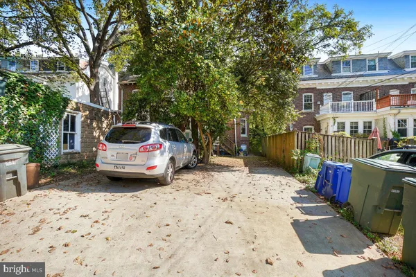 a car parked in front of a house