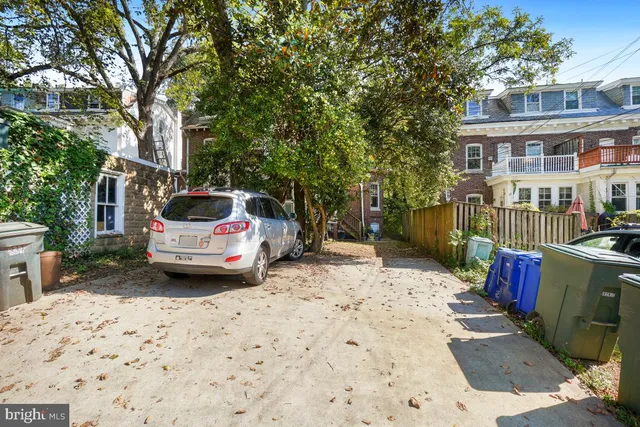 a car parked in front of a house