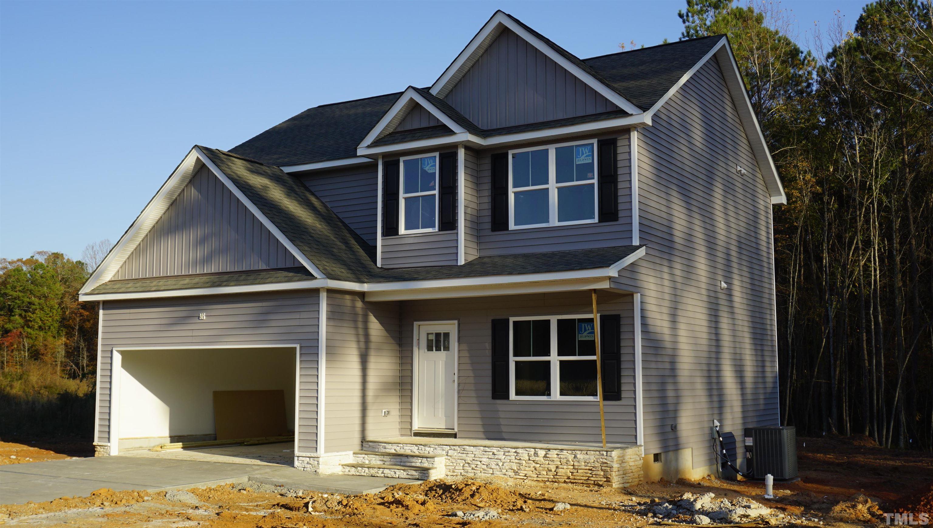 10645 West Old Spring Hope Road Spring Hope, NC 27882 - Photo 1 of 13 a front view of a house with a yard