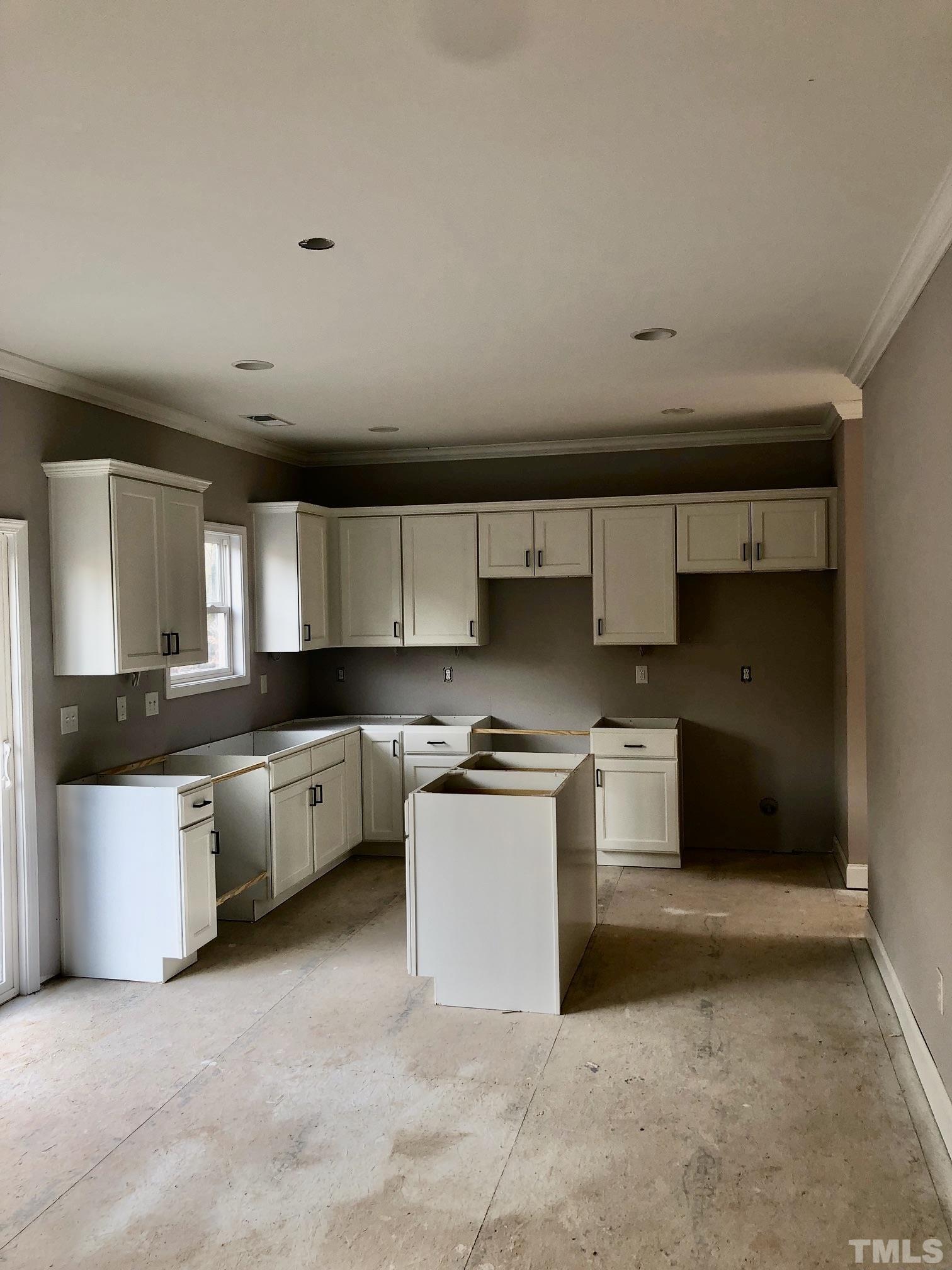 10645 West Old Spring Hope Road Spring Hope, NC 27882 - Photo 10 of 13 a kitchen with stainless steel appliances granite countertop a stove a sink and a refrigerator