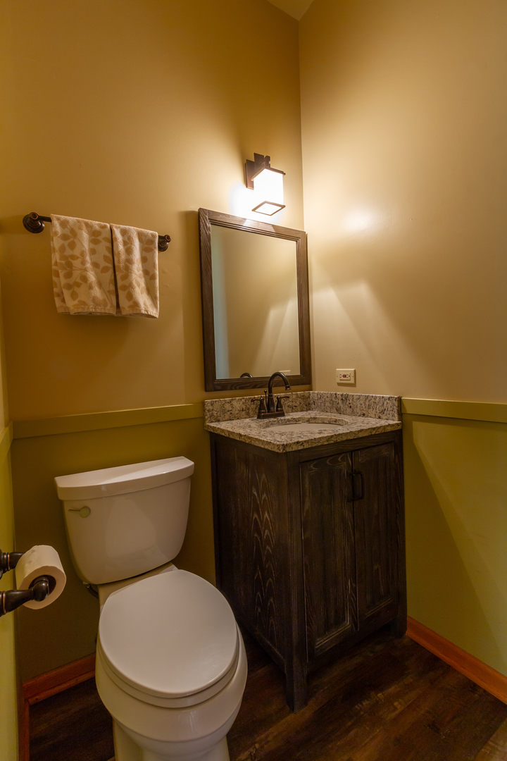 14N566 Timber Ridge Drive Elgin, IL 60124 - Photo 17 of 43 a bathroom with a toilet sink and mirror