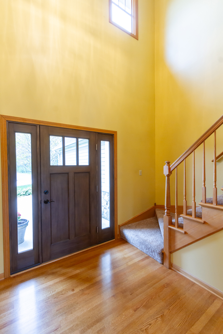14N566 Timber Ridge Drive Elgin, IL 60124 - Photo 3 of 43 a view of a room with wooden floor and windows