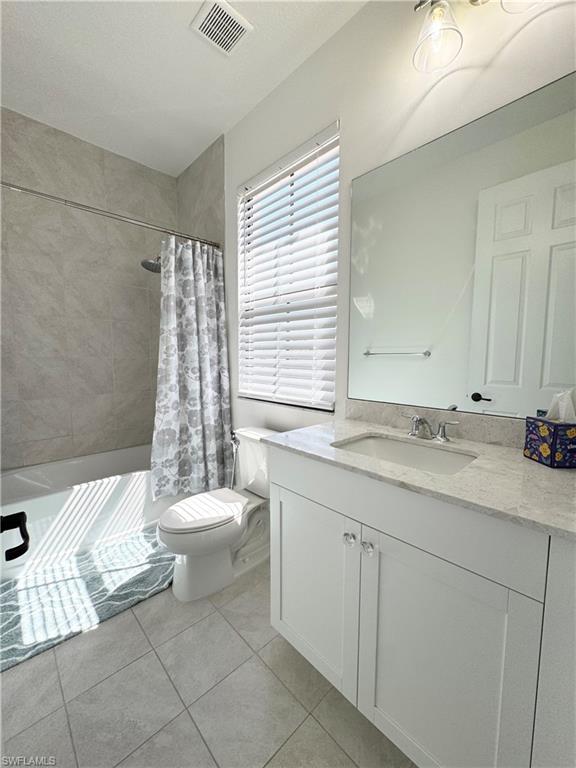 8984 Madrid Circle Naples, FL 34104 - Photo 13 of 28 a bathroom with a sink toilet and shower