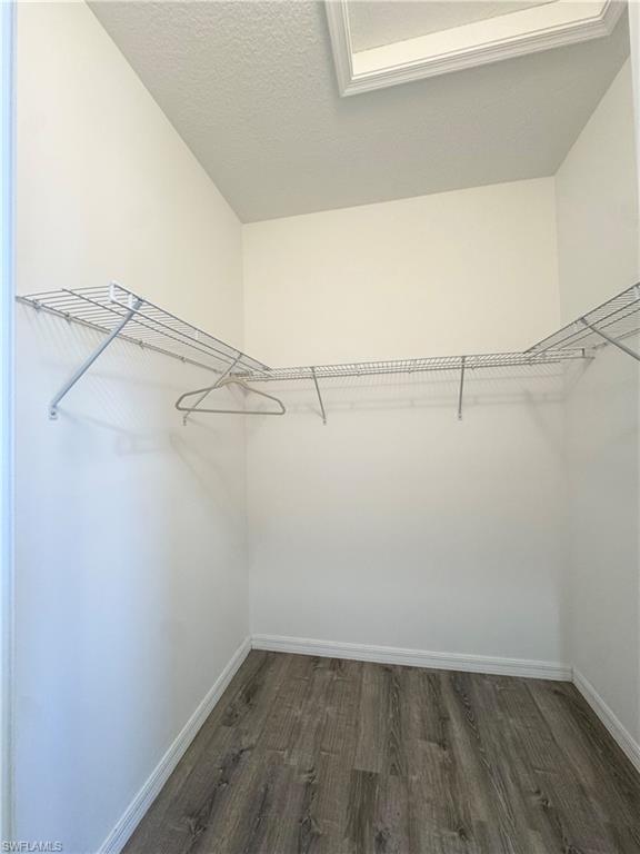 8984 Madrid Circle Naples, FL 34104 - Photo 19 of 28 a view of a room with racks on the wall