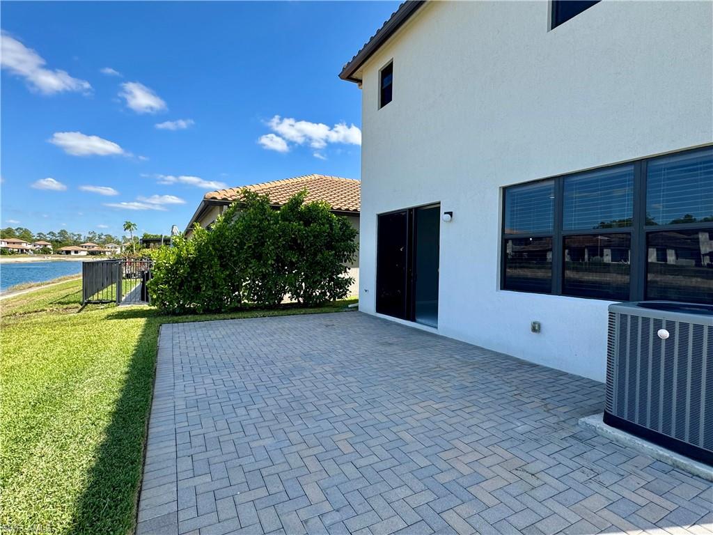 8984 Madrid Circle Naples, FL 34104 - Photo 24 of 28 a view of a porch with a yard