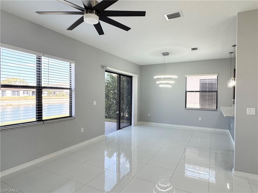 8984 Madrid Circle Naples, FL 34104 - Photo 3 of 28 a view of an empty room with a window