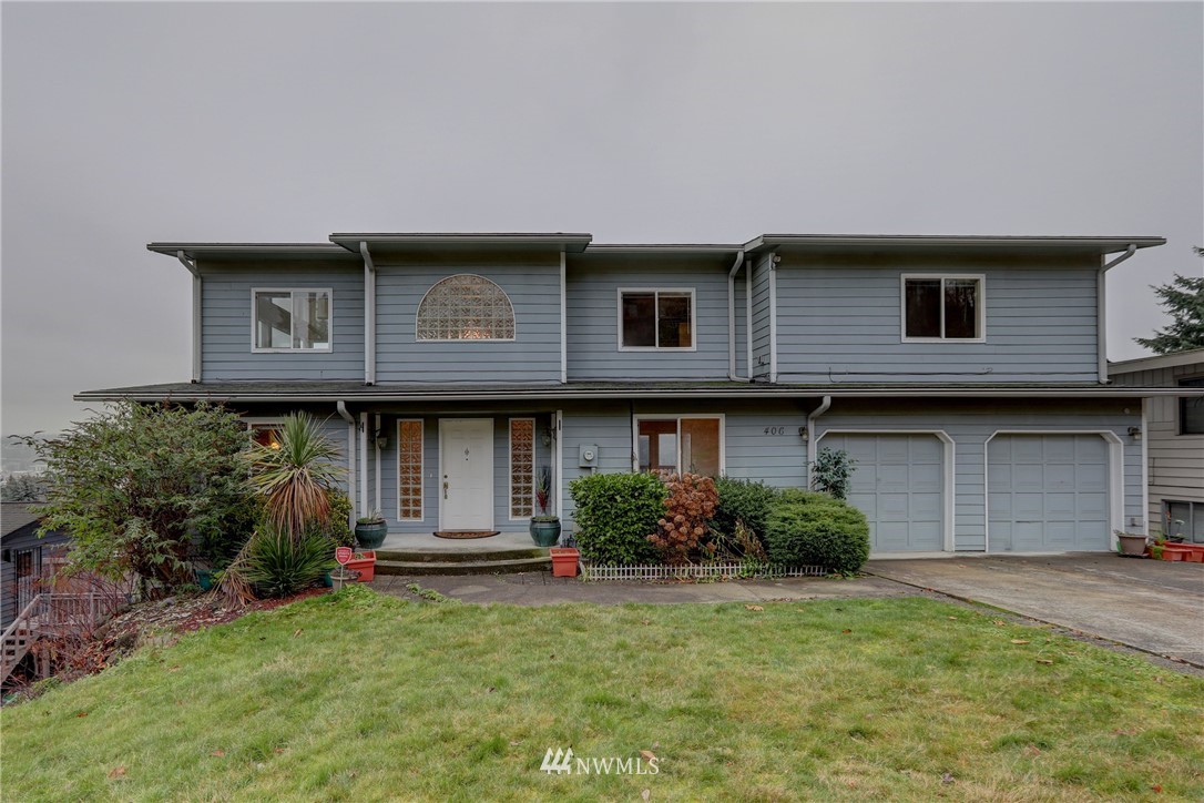 406 Stevens Avenue Northwest Renton, WA 98057 - Photo 1 of 24 a front view of a house with a garden