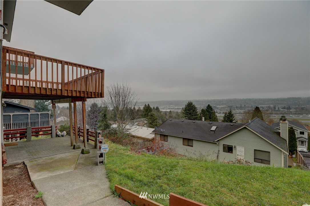 406 Stevens Avenue Northwest Renton, WA 98057 - Photo 23 of 24 a view of a house with backyard porch and sitting area