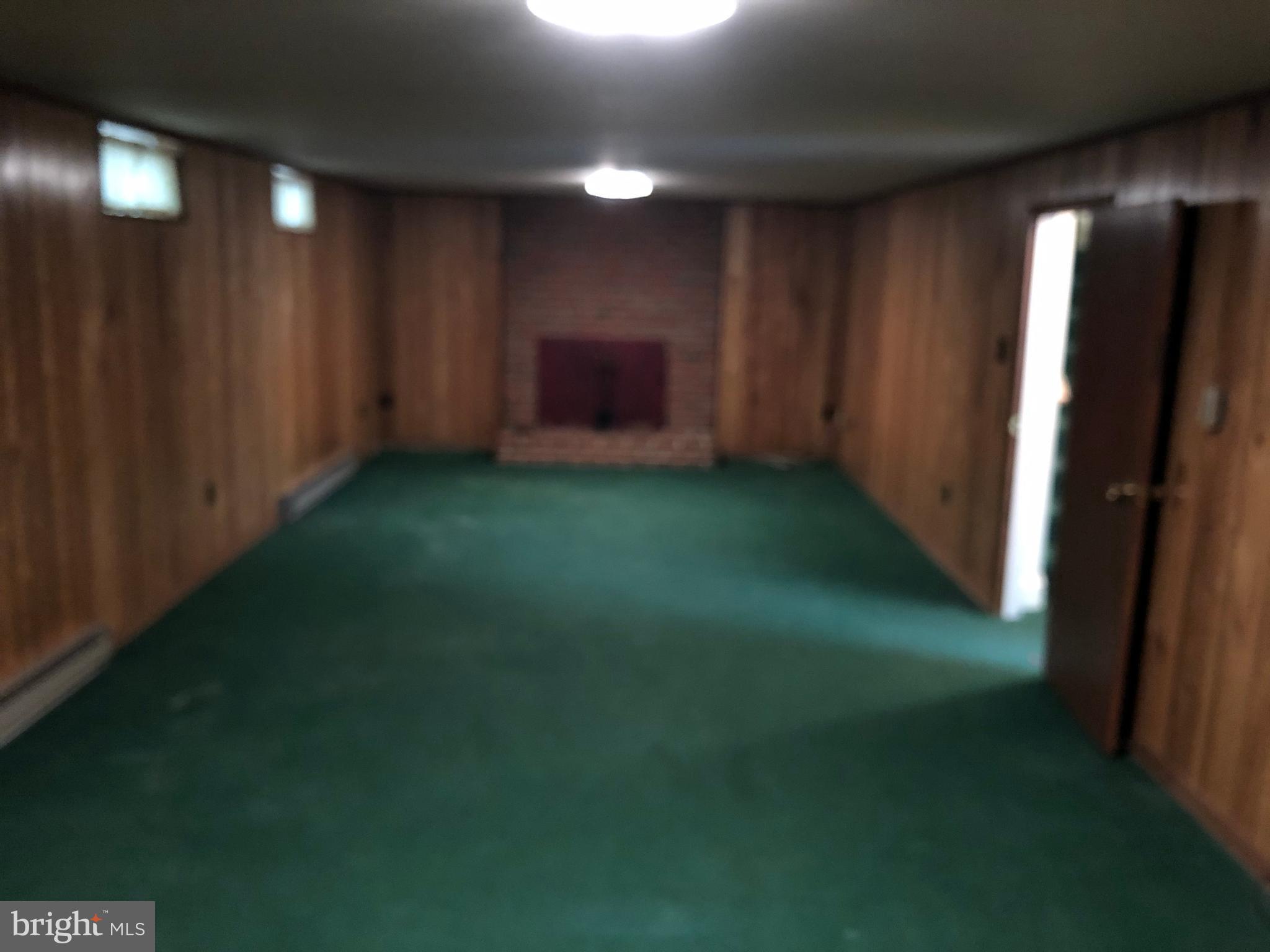 707 Anne Street Southwest Leesburg, VA 20175 - Photo 9 of 14 rec room lower level with woodburning fp