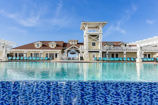 a view of a swimming pool with a garden