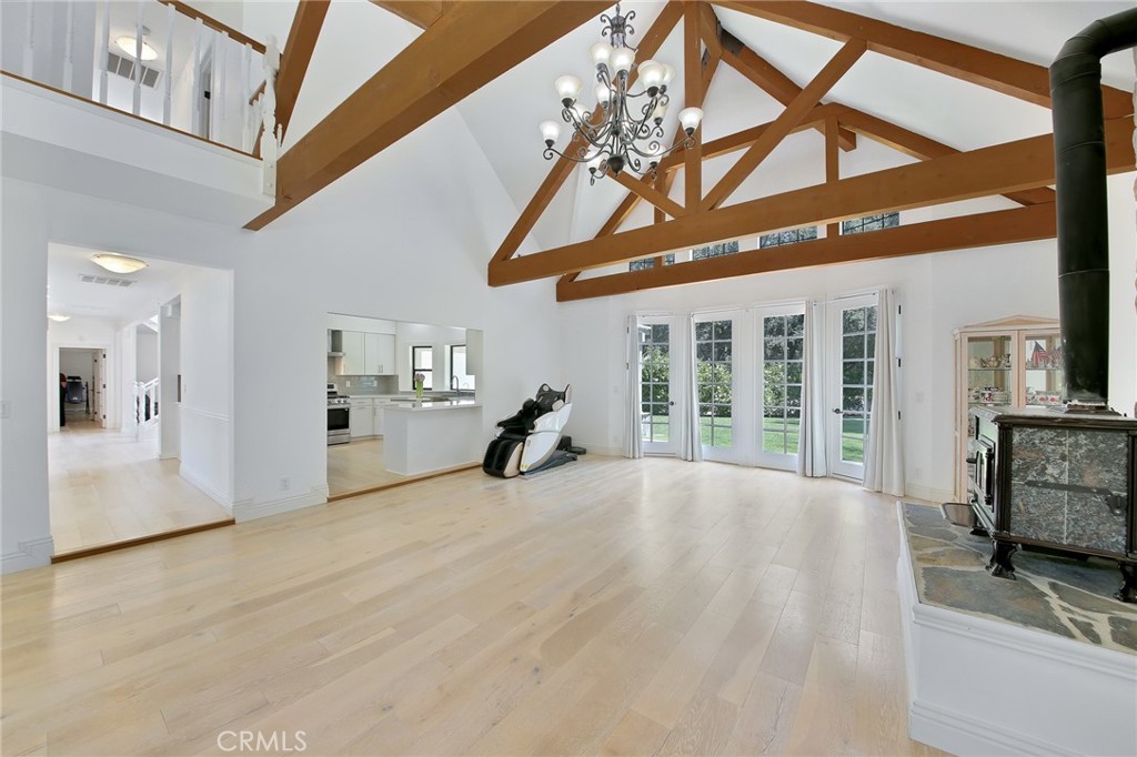 15601 Saddleback Road Canyon Country, CA 91387 - Photo 8 of 55 a view of an entryway with a floor to ceiling window and a car parked