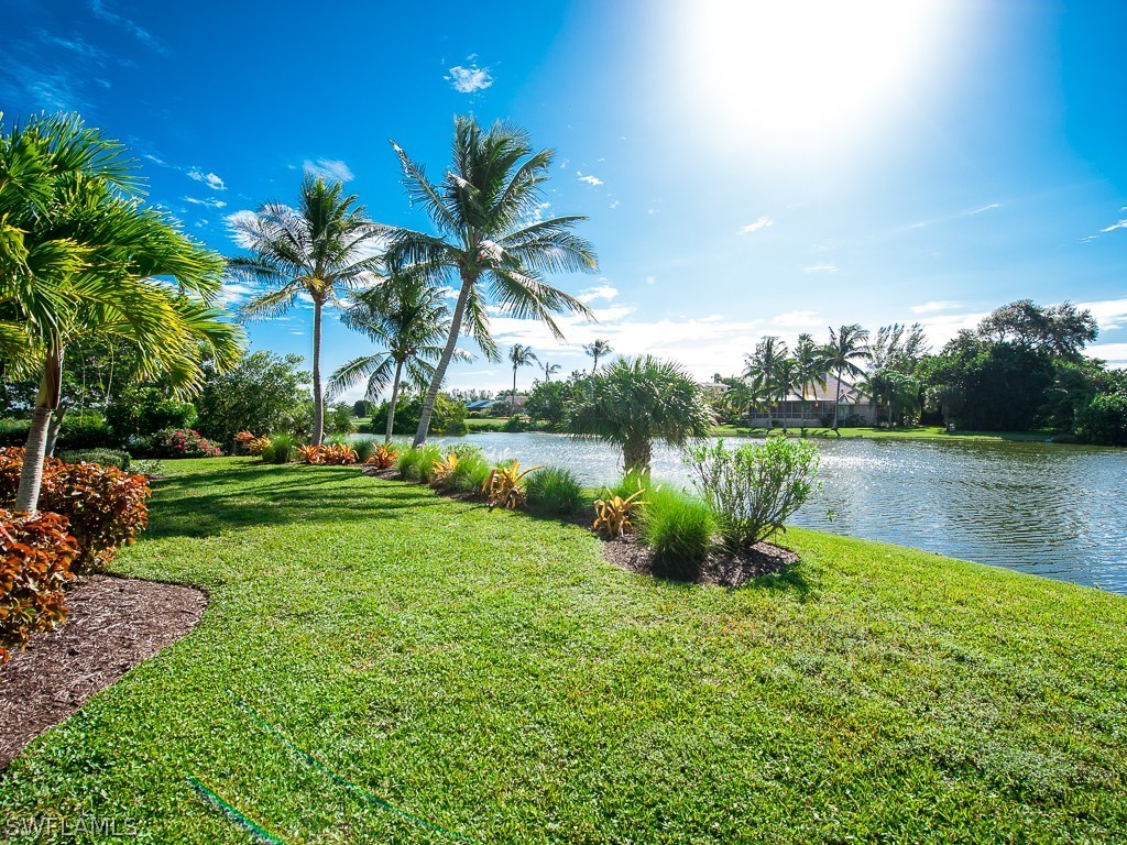 1467 Sand Castle Road Sanibel, FL 33957 - Photo 31 of 35 a view of a lake with a big yard