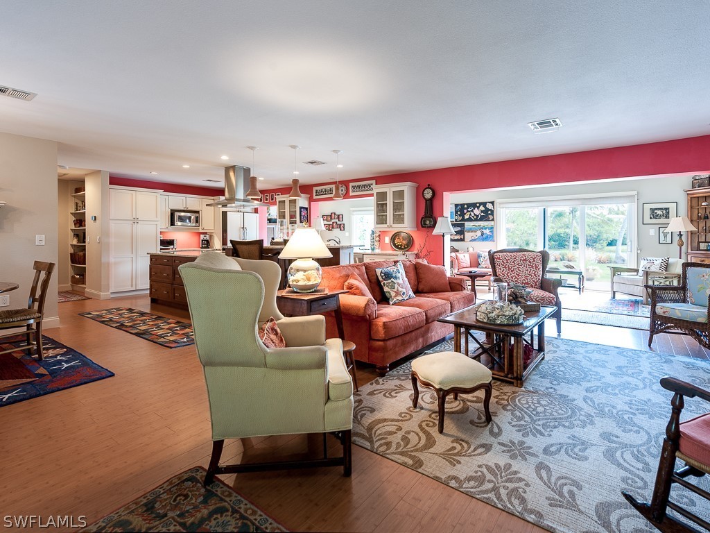 1467 Sand Castle Road Sanibel, FL 33957 - Photo 6 of 35 a living room with furniture and a large window