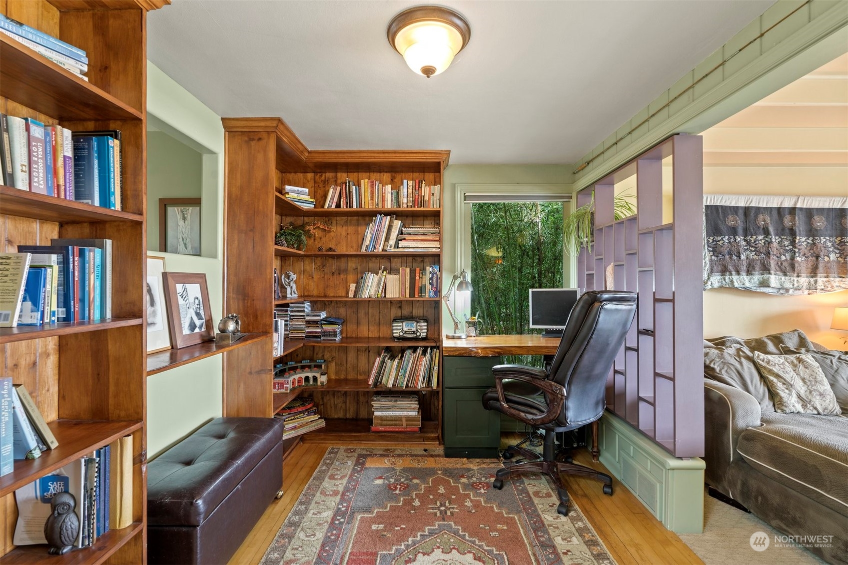 426 Lakeview Road Lynnwood, WA 98087 - Photo 15 of 33 a view of a workspace with furniture and a bookshelf