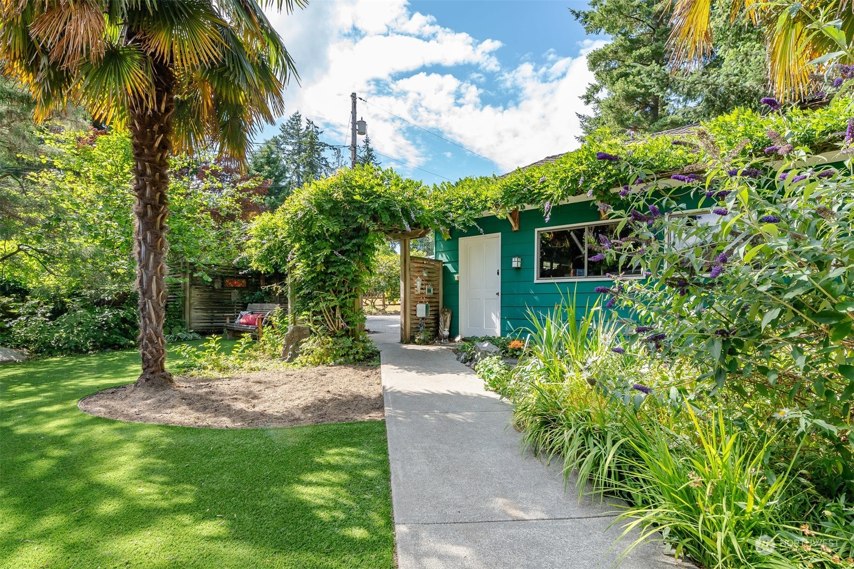 426 Lakeview Road Lynnwood, WA 98087 - Photo 26 of 33 a view of a yard with potted plants and palm trees