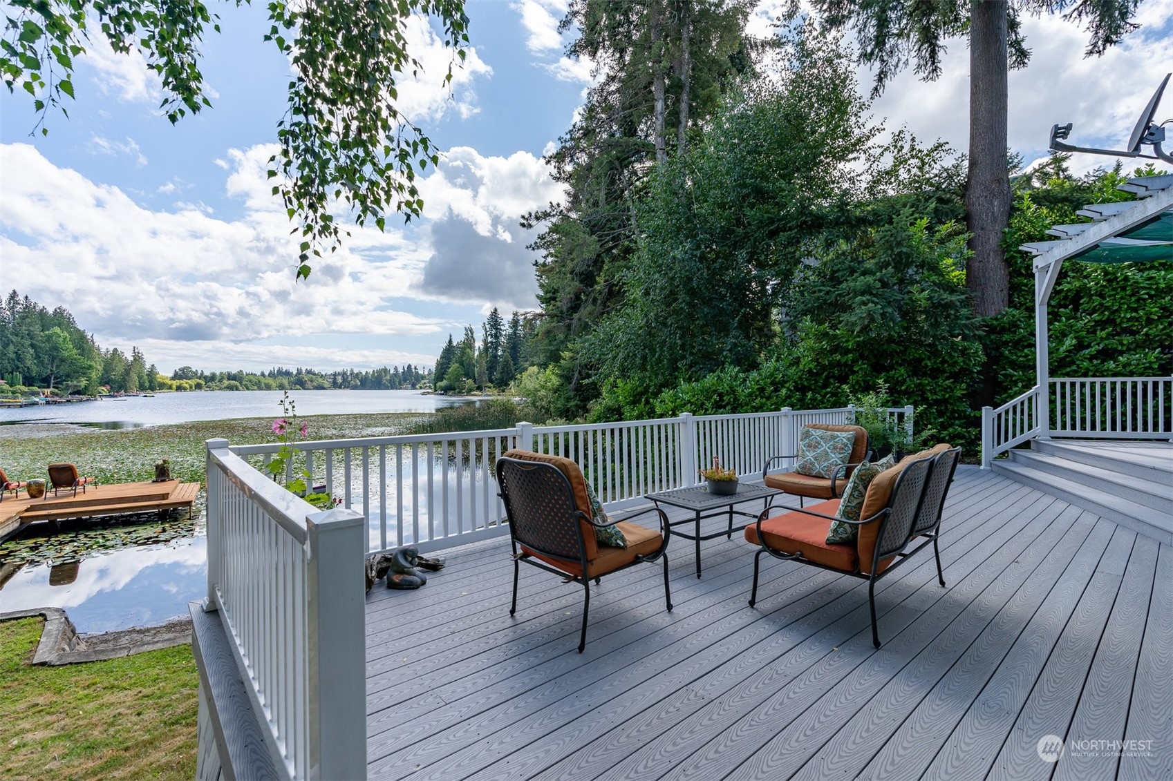 426 Lakeview Road Lynnwood, WA 98087 - Photo 4 of 33 an outdoor sitting area with furniture and wooden floor