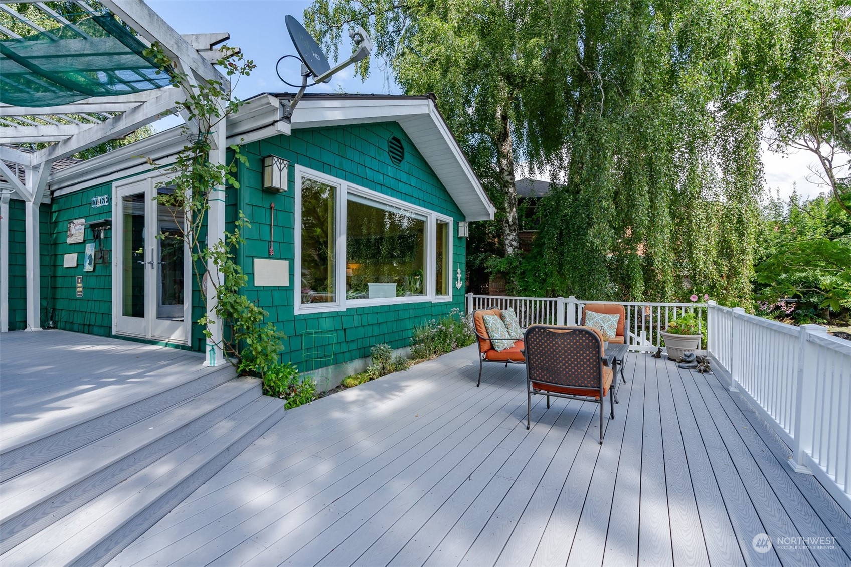 426 Lakeview Road Lynnwood, WA 98087 - Photo 5 of 33 a view of a chair and tables in the patio in front of the house