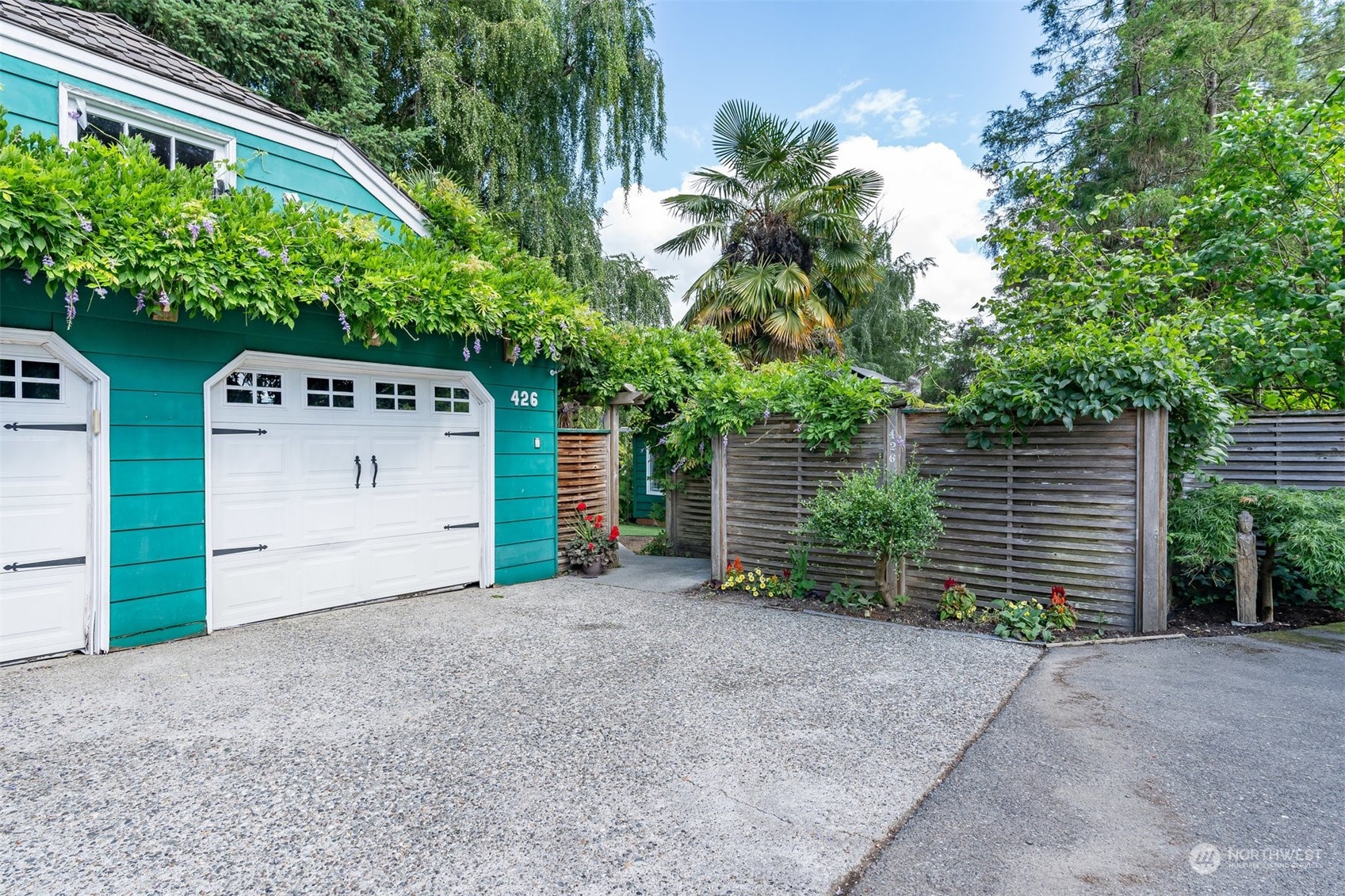 426 Lakeview Road Lynnwood, WA 98087 - Photo 6 of 33 a view of a house with a yard and garage