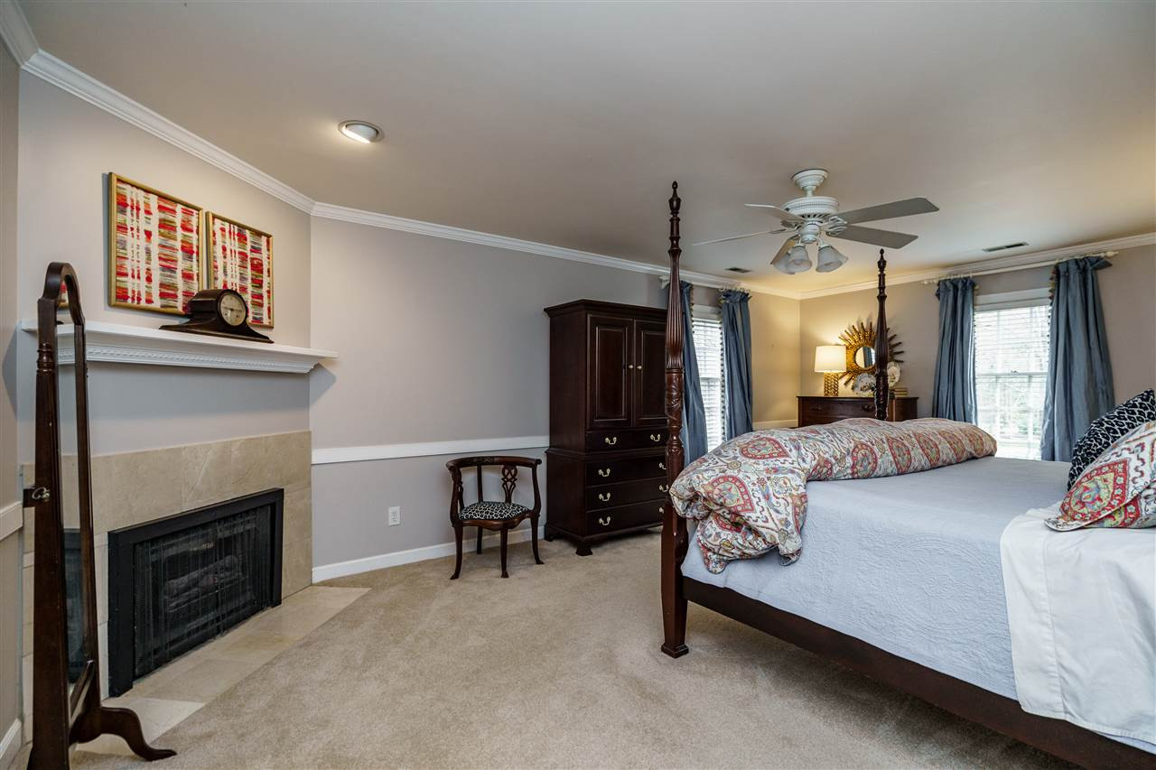 10709 Dunhill Terrace Raleigh, NC 27615 - Photo 16 of 30 Master Bedroom is both large, functional, and cozy at the same time. Fireplace for added ambiance. Master Bedroom