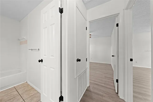 a view of a bathroom from the hallway