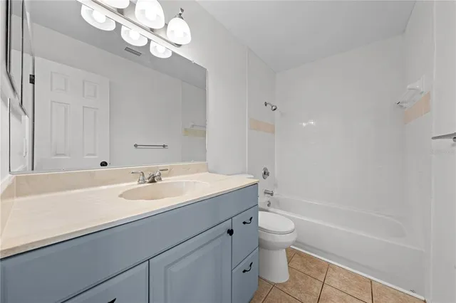 a bathroom with a sink a toilet and a bathtub