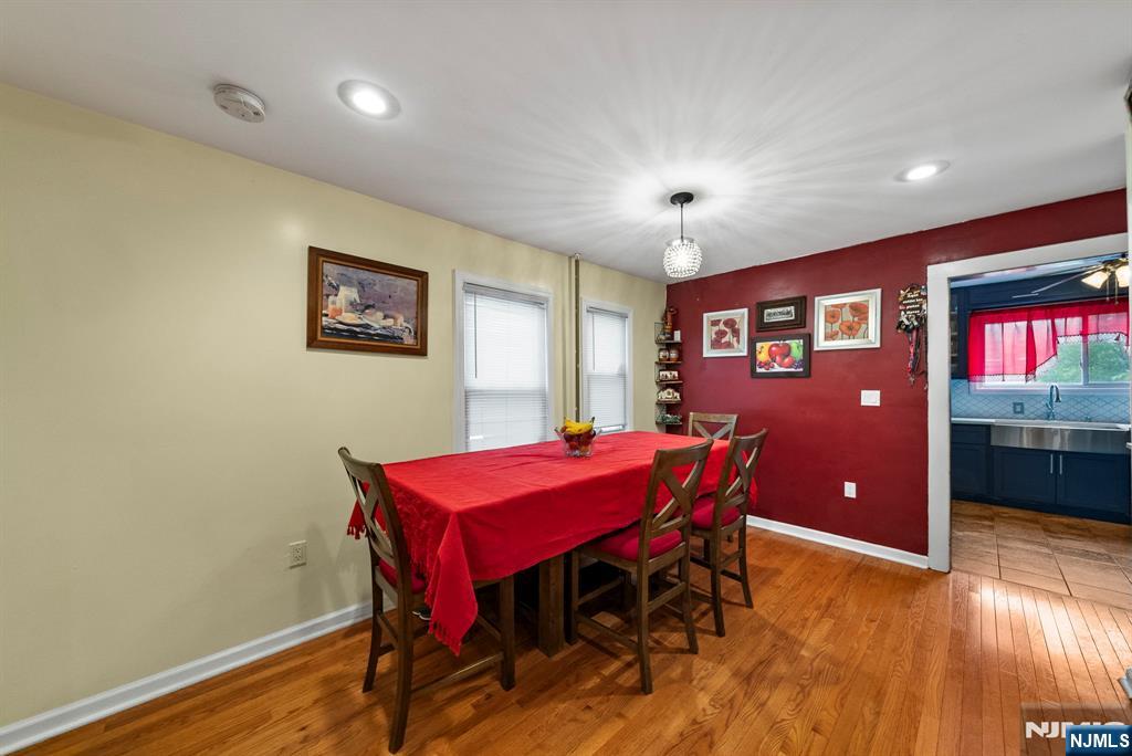 298 3rd Street Hackensack, NJ 07601 - Photo 11 of 36 a view of a dining room with furniture and wooden floor