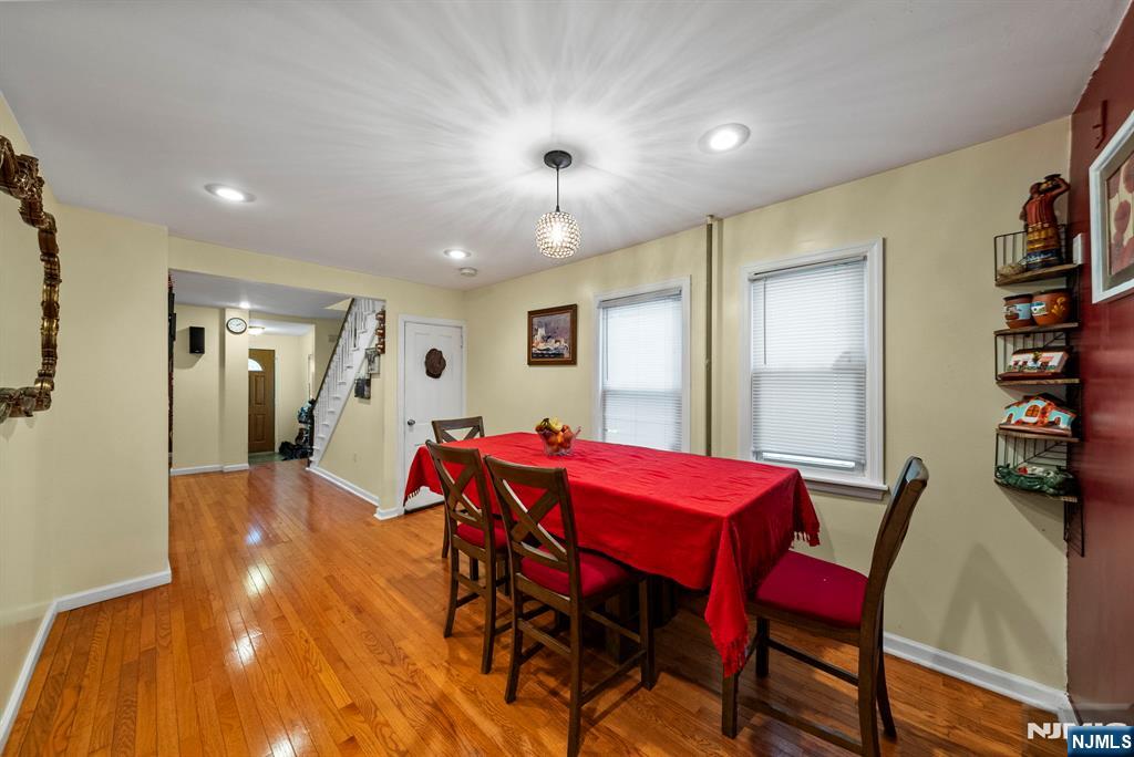 298 3rd Street Hackensack, NJ 07601 - Photo 12 of 36 a view of a dining room with furniture and a chandelier