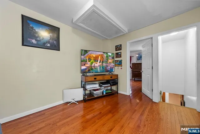 a view of a livingroom with furniture and wooden floor