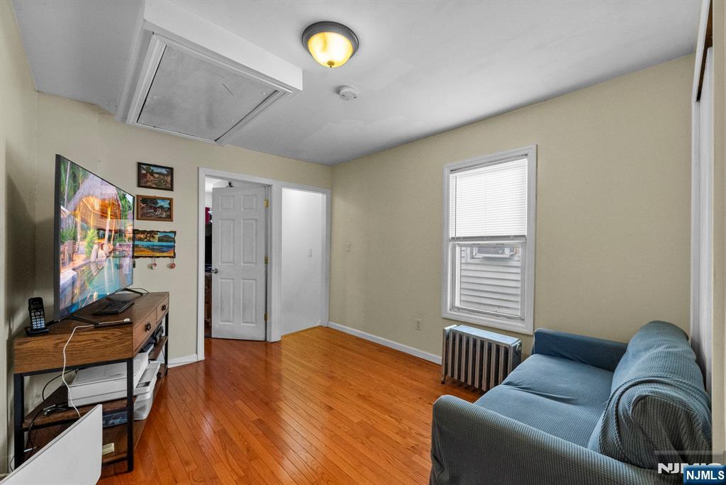 298 3rd Street Hackensack, NJ 07601 - Photo 19 of 36 a livingroom with workspace and a window